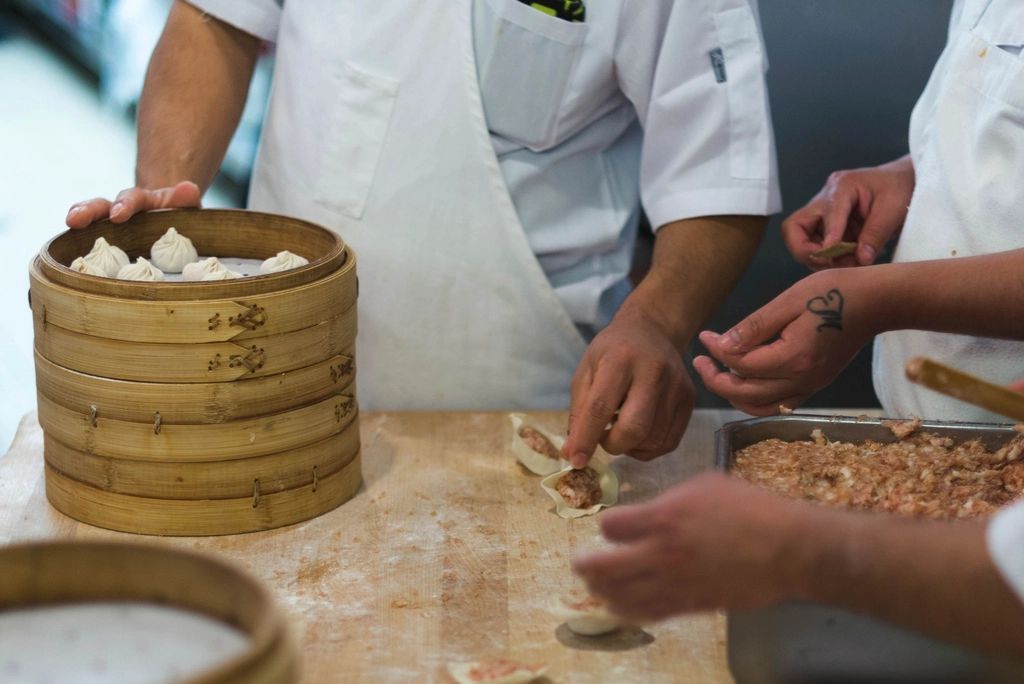 A cook working at the open kitchen