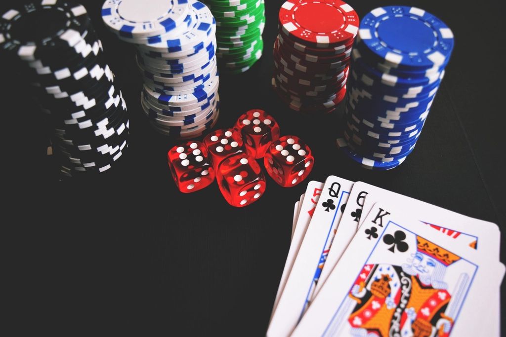 Gaming chips and cards on the table felt