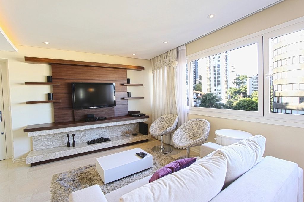 A suite sitting room with a sofa and armchairs